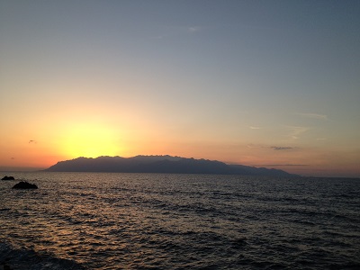 Sunset Behind Yakushima With Few Clouds And Bright Glow